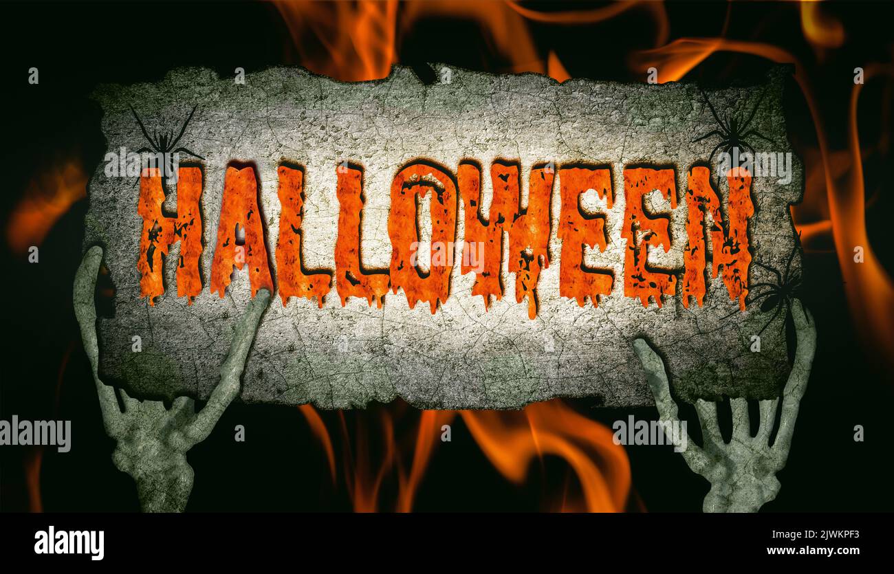 Mani ossee umane tenere un segno con l'iscrizione Halloween. Foto Stock