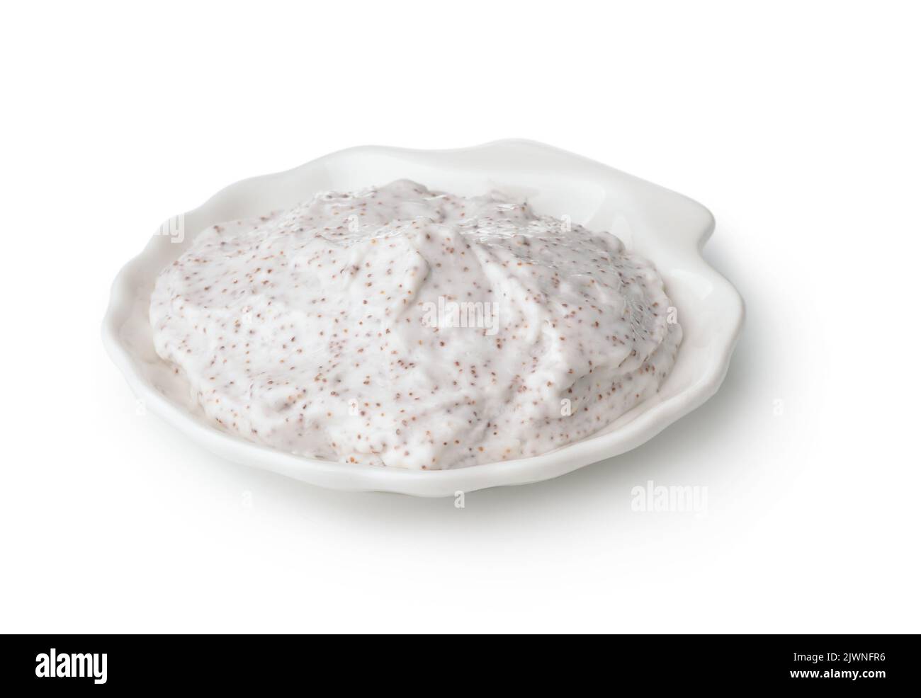 Scrub corpo esfoliante in tazza di ceramica bianca isolato su bianco Foto Stock