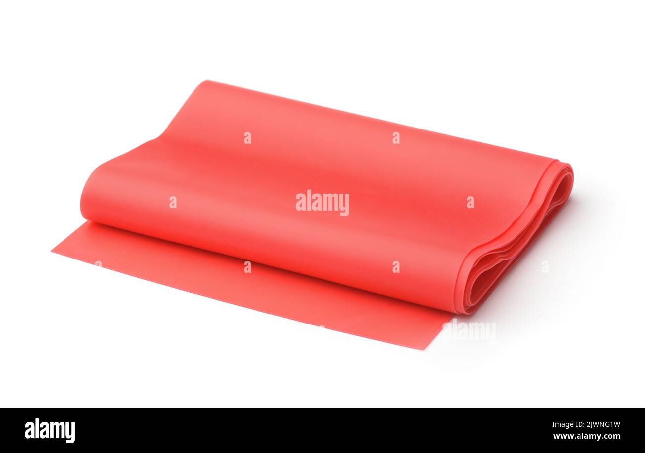 Rotolo di fascia elastica rossa per il fitness isolato su bianco Foto Stock