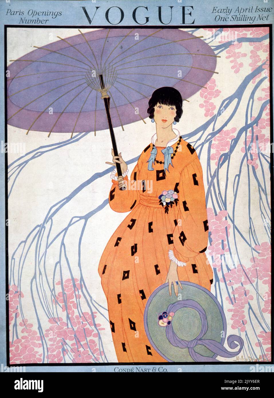 Copertina della rivista Vogue, all'inizio di aprile, pubblicata da Cond Nast and Co., Londra; una signora tiene un ombrellone sotto un albero e indossa un abito arancione con un cappello a bordo largo. Foto Stock