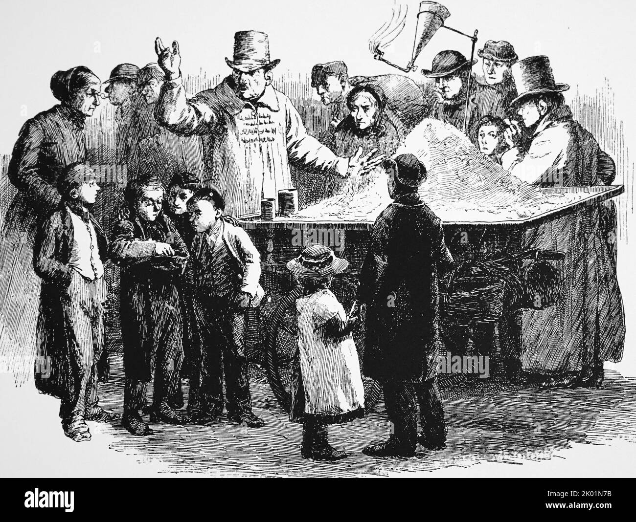 Vendita di noci in una strada londinese a Natale. Foto Stock