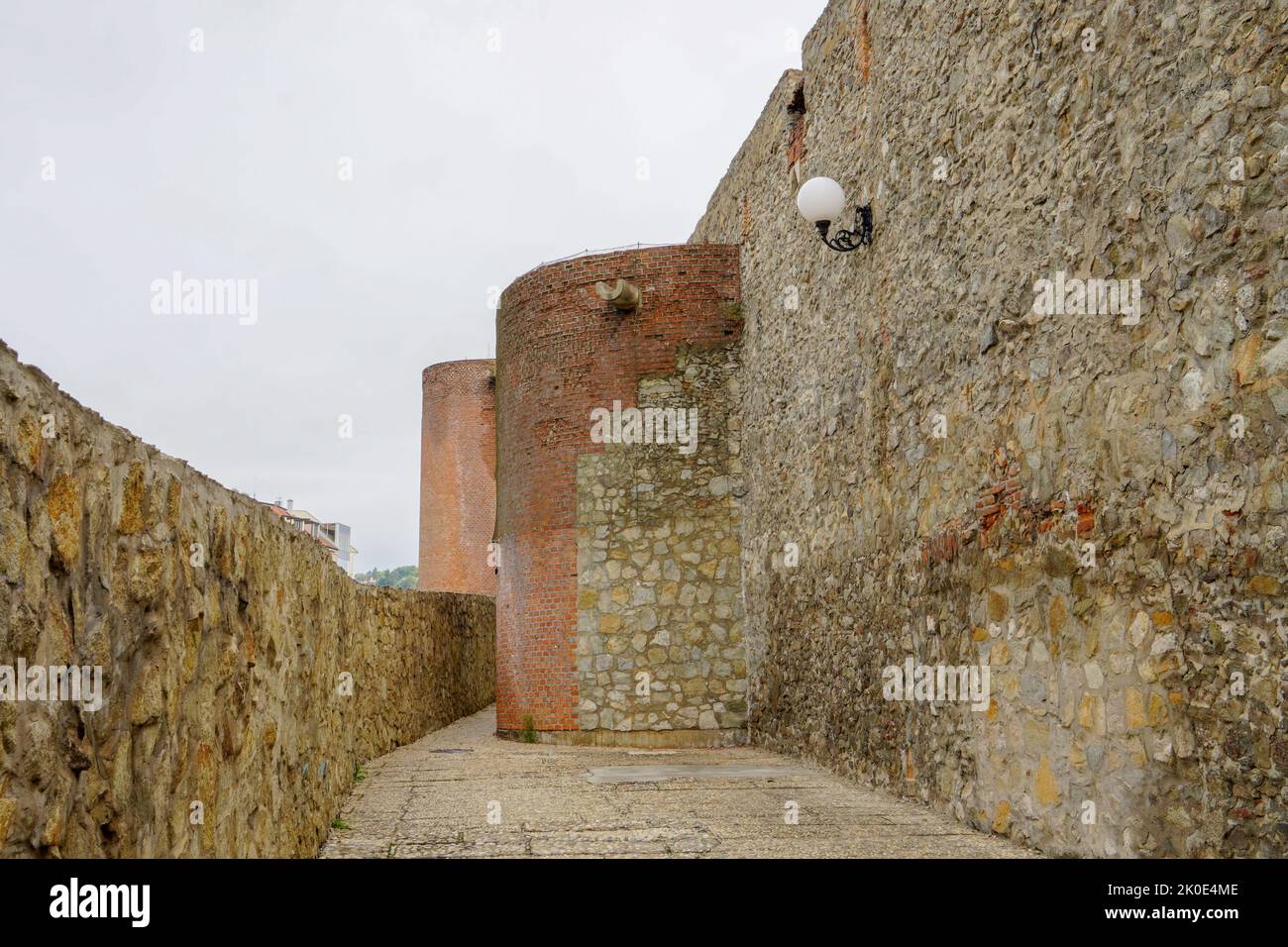 Muro di pietra e il marciapiede, scene di sfondo Foto Stock