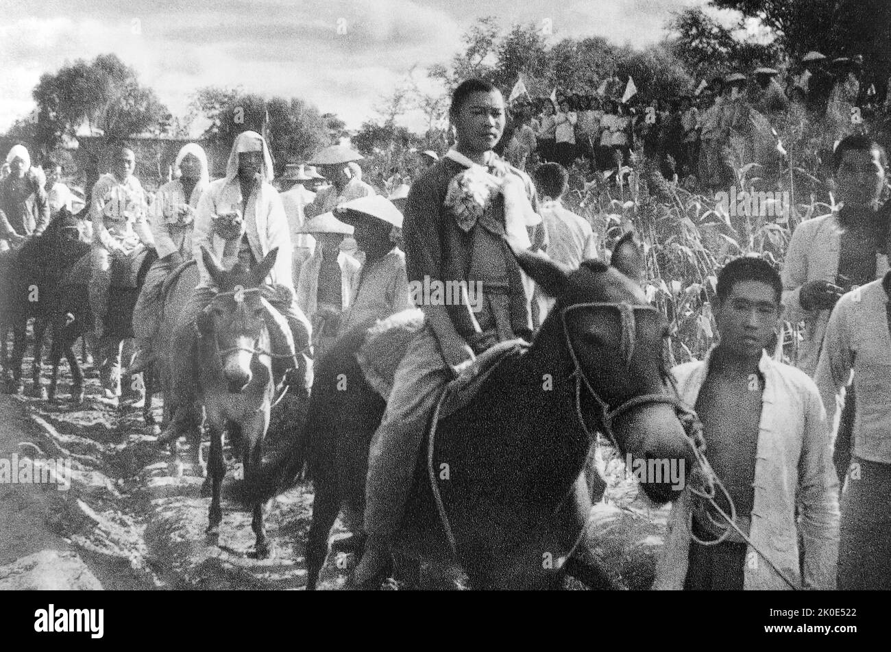 Gli operai agricoli cinesi si uniscono alla resistenza contro l'invasione giapponese della Cina, 1937. Foto Stock