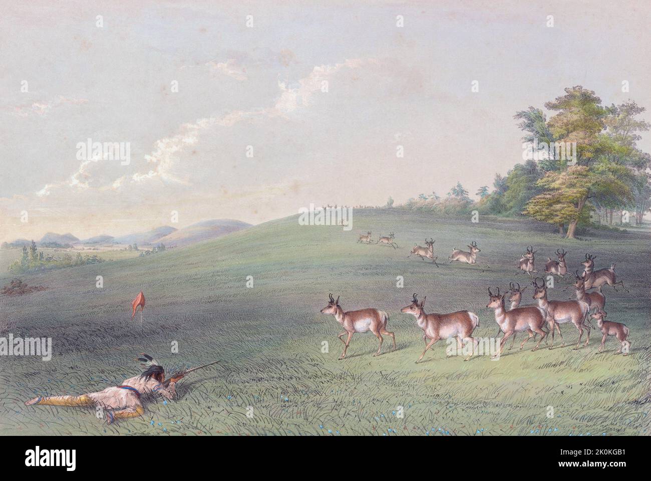 Riprese in Antelope. Un indiano che giace incline sull'erba spara il suo fucile contro un'antilope. Le antilopi sono curiose e l'indiano ha appeso una striscia di stoffa rossa su un bastone per tentare la loro curiosità. Dal North American Indian Portfolio di Catlin, pubblicato a Londra nel 1844 dall'artista, avventuriero americano George Catlin, 1796 - 1872. Durante molti viaggi Catlin registrò con penna e pennello i costumi e gli stili di vita delle tribù dei nativi americani. Foto Stock