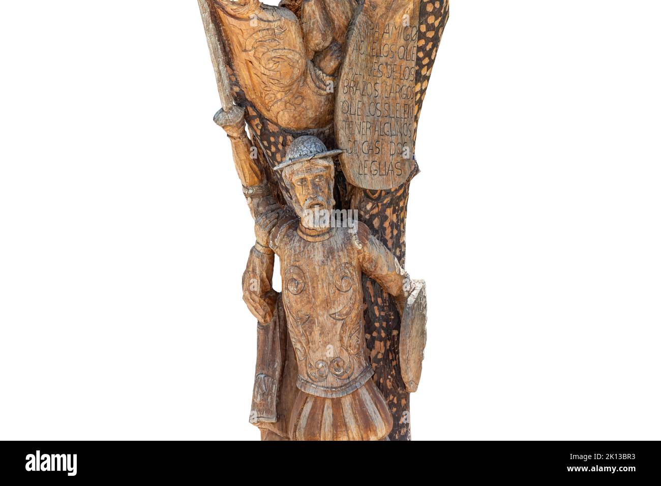 Particolare della statua di Don Chisciotte scolpita nel tronco di un albero. Il testo fa parte del libro di Don Miguel de Cervantes, Don Chisciotte de la Mancha Foto Stock