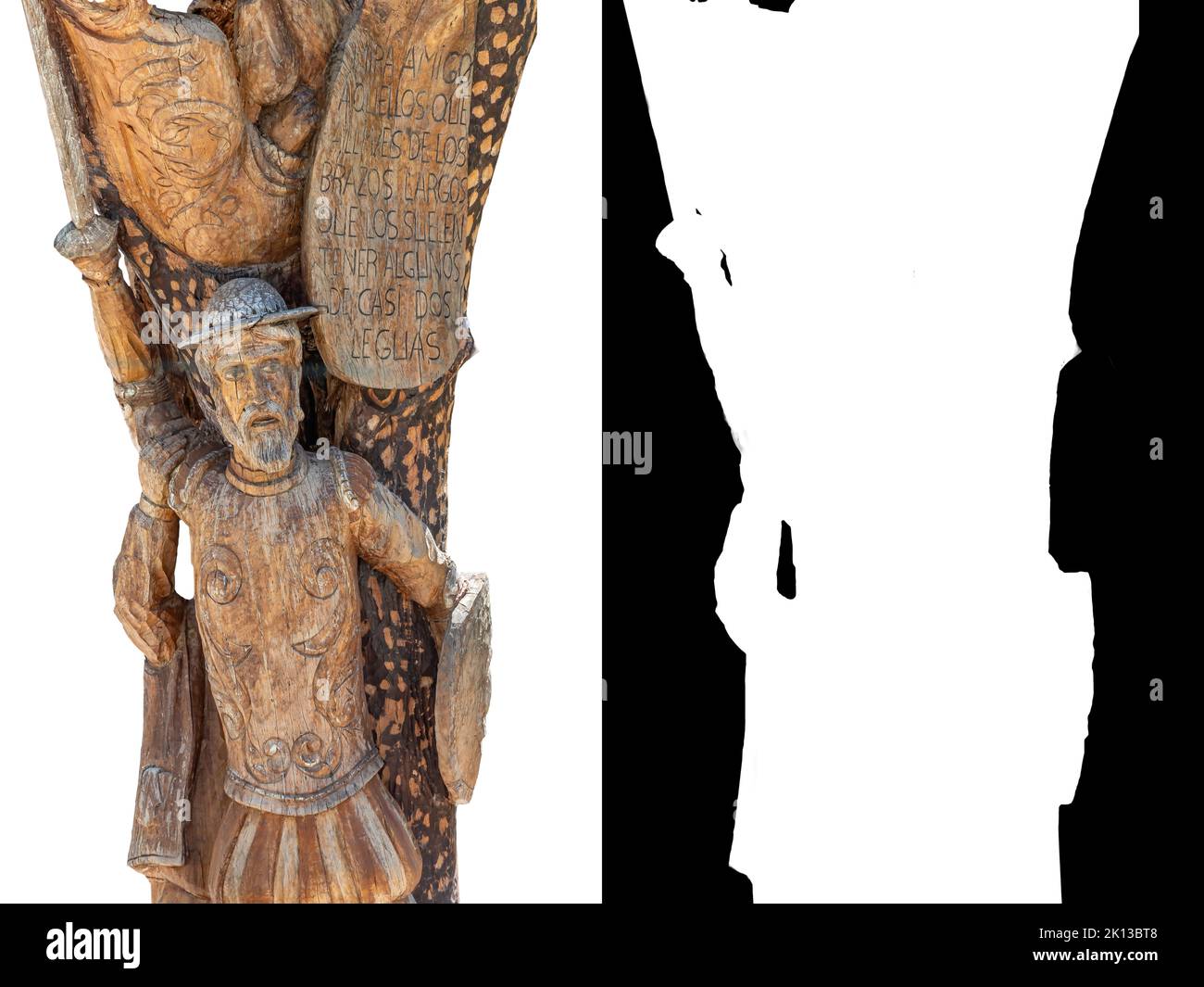 Particolare della statua di Don Chisciotte scolpita nel tronco di un albero. Il testo fa parte del libro di Don Miguel de Cervantes, Don Chisciotte de la Mancha Foto Stock