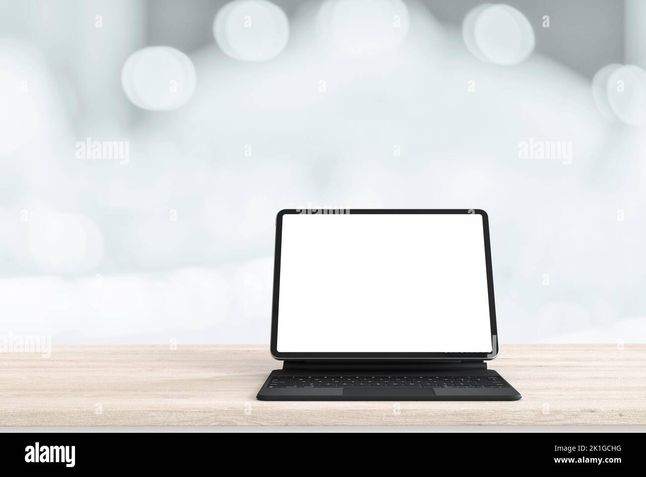 Digital tablet mock up posto su tavolo di legno astratto sfocato sfondo interno per il design sfondo, composizione bokeh per , sito web, rivista o. Foto Stock