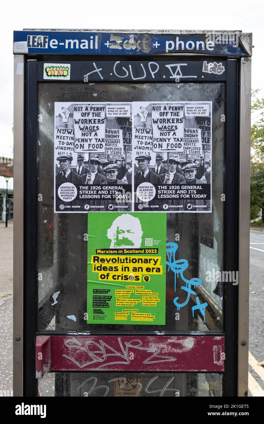 Glasgow Socialist Workers Party and Marxism in Scotland Posters on phone box, Glasgow, Scotland, UK Foto Stock