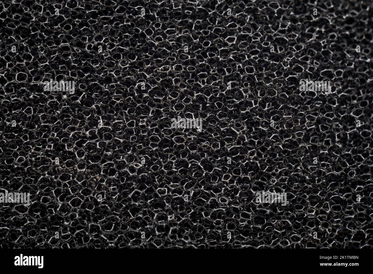 striscione di spugna in gomma schiuma poliuretanica nera macro Foto Stock