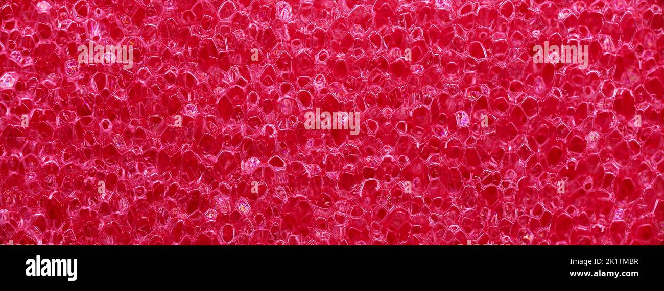 striscione di spugna in gomma schiuma poliuretanica rosa macro Foto Stock