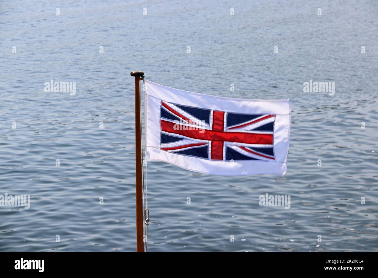 Bandiera dell'Unione che vola a flagpole Foto Stock