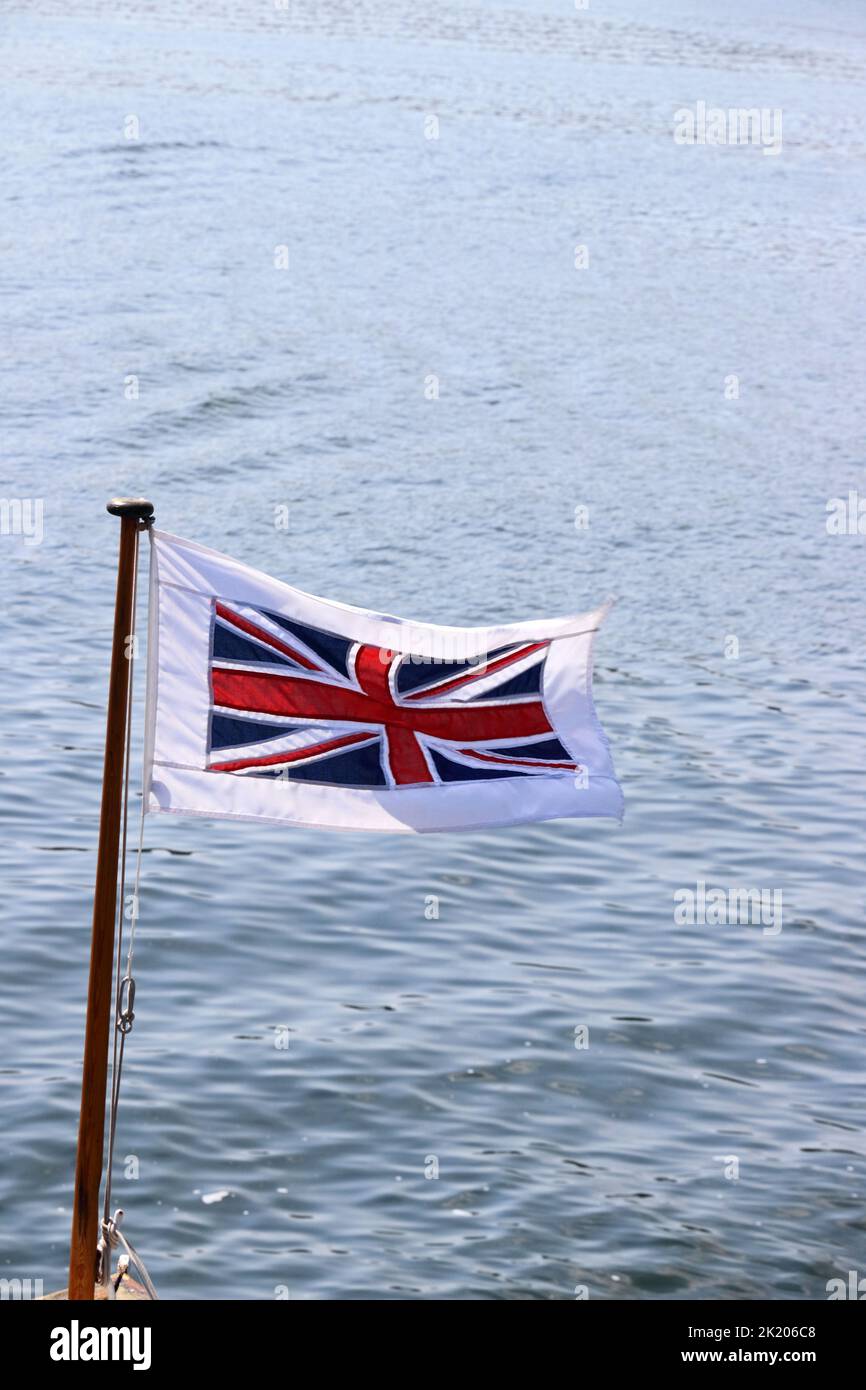 Bandiera dell'Unione che vola a flagpole Foto Stock