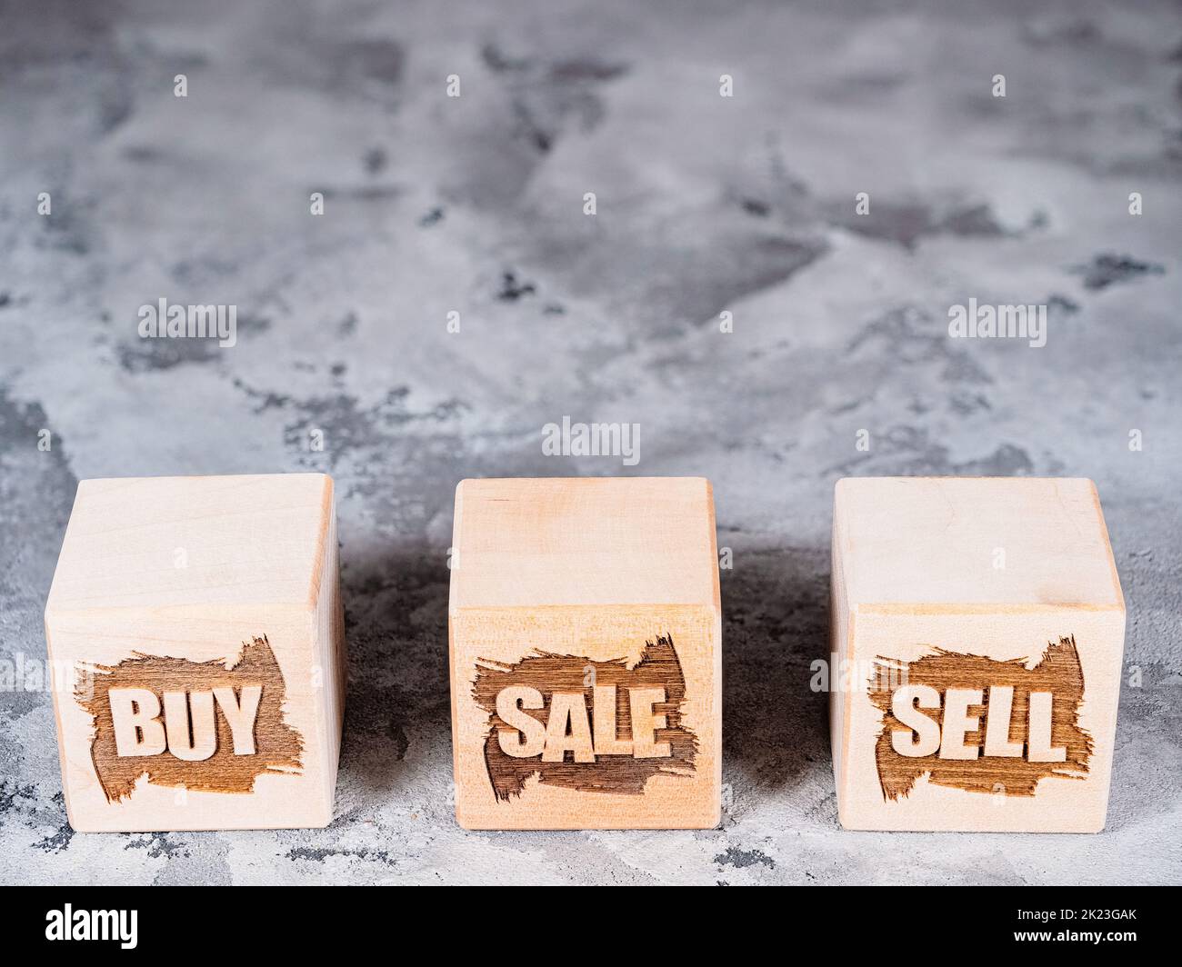 COMPRA, VENDI e VENDI simboli su cubi di legno come business Grow concetto Foto Stock