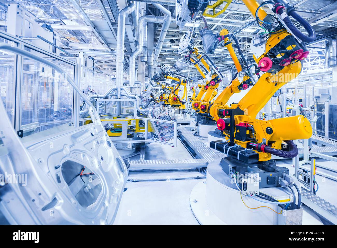 Bracci robotizzati in un impianto di auto Foto Stock