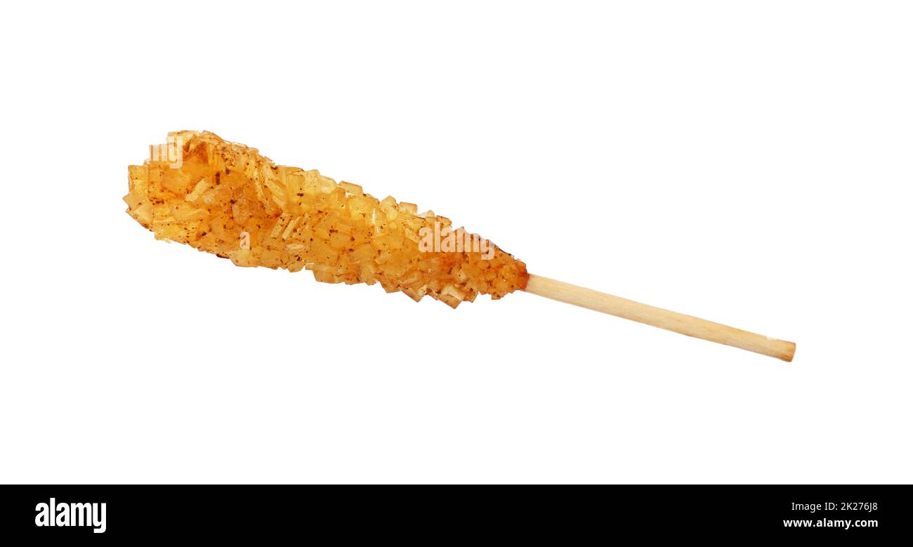 Un bastone di legno con cristalli di zucchero di canna Foto Stock