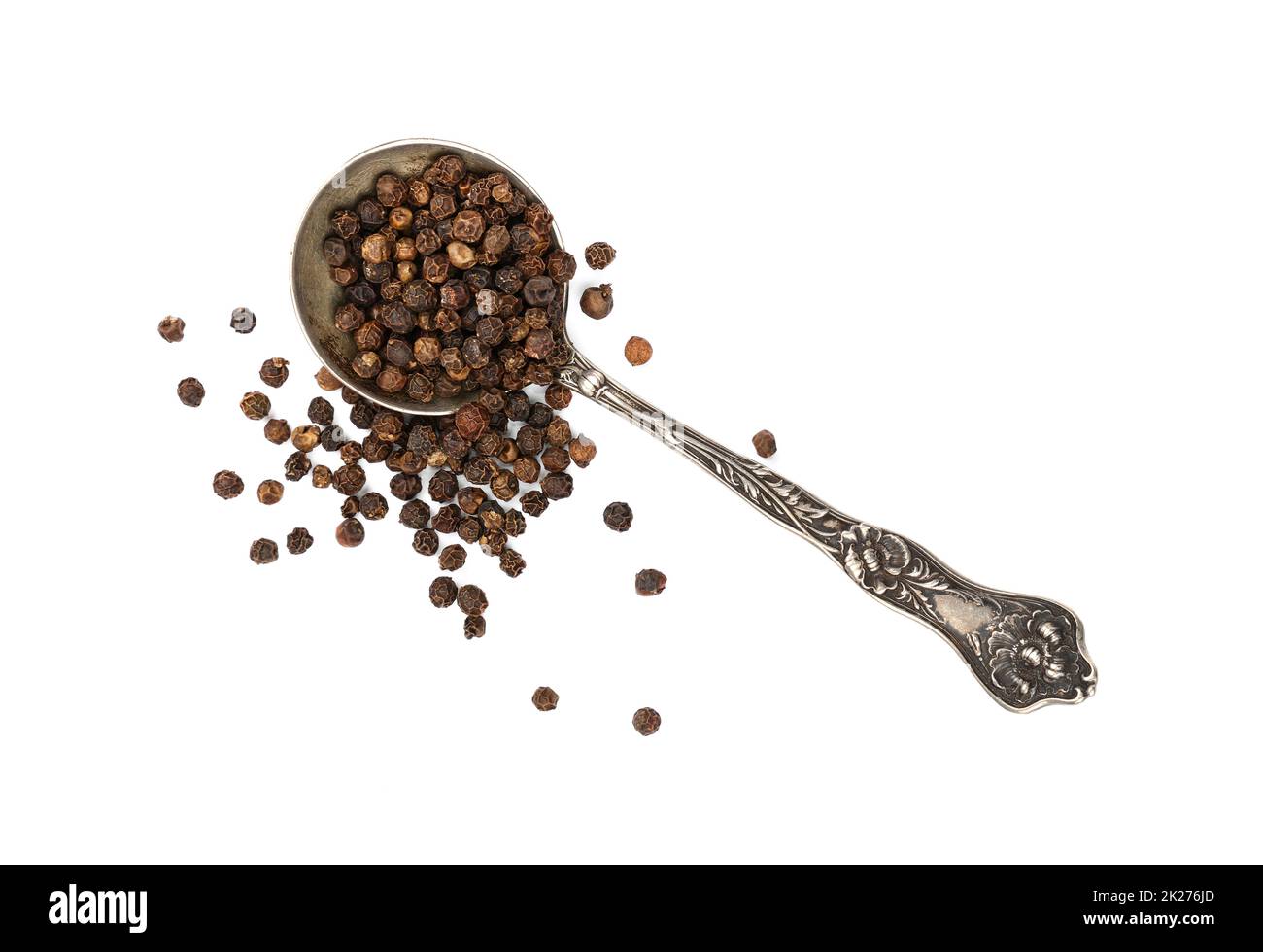 Cucchiaio di metallo pieno di pepe nero Foto Stock