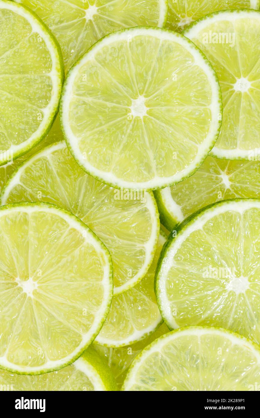 Limes agrumi lime raccolta cibo sfondo ritratto formato frutta fresca Foto Stock