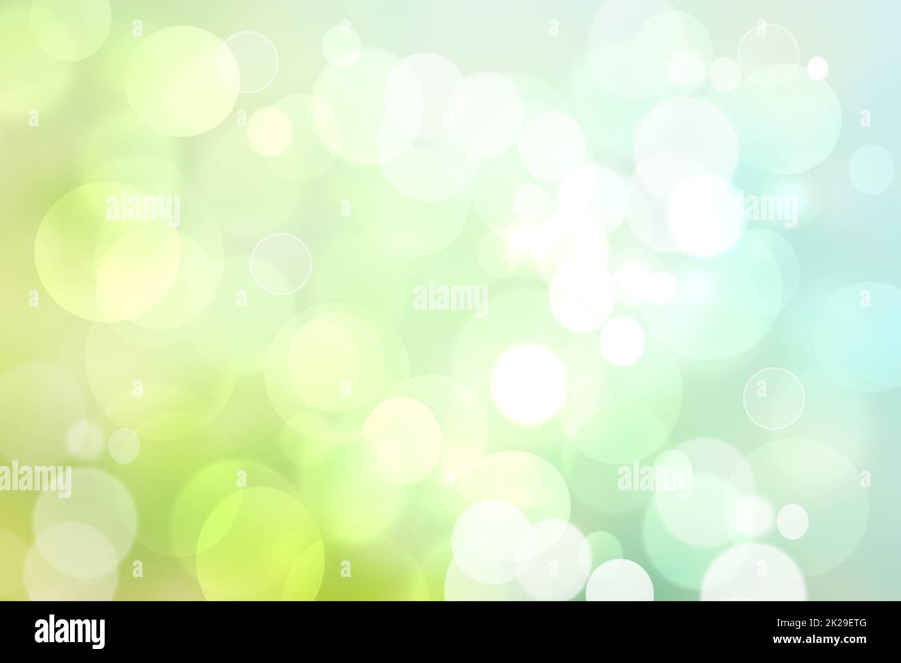 Gradiente di astratta luce verde turchese brillante sfondo sfocato texture con bokeh di fondo circolare luci. Bello sfondo. Spazio per il design. Foto Stock