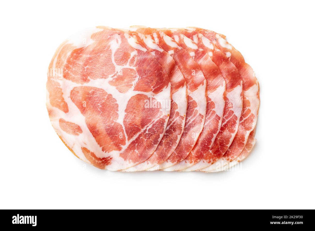 Prosciutto italiano secco. Coppa Stagionata isolata su sfondo bianco. Foto Stock