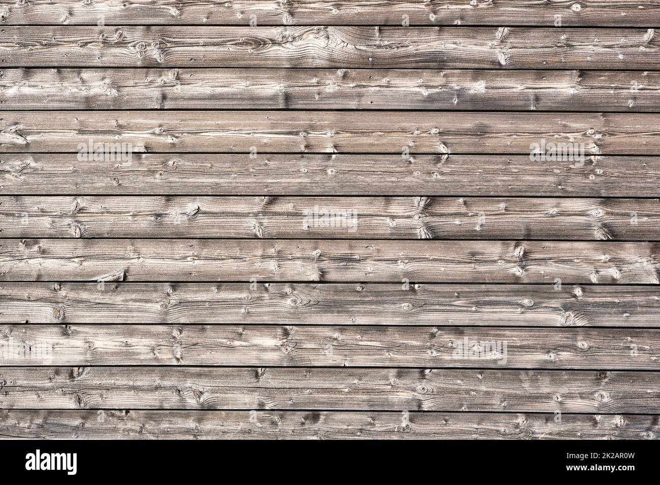 Sfondo da un muro fatto di tavole orizzontali di legno Foto Stock