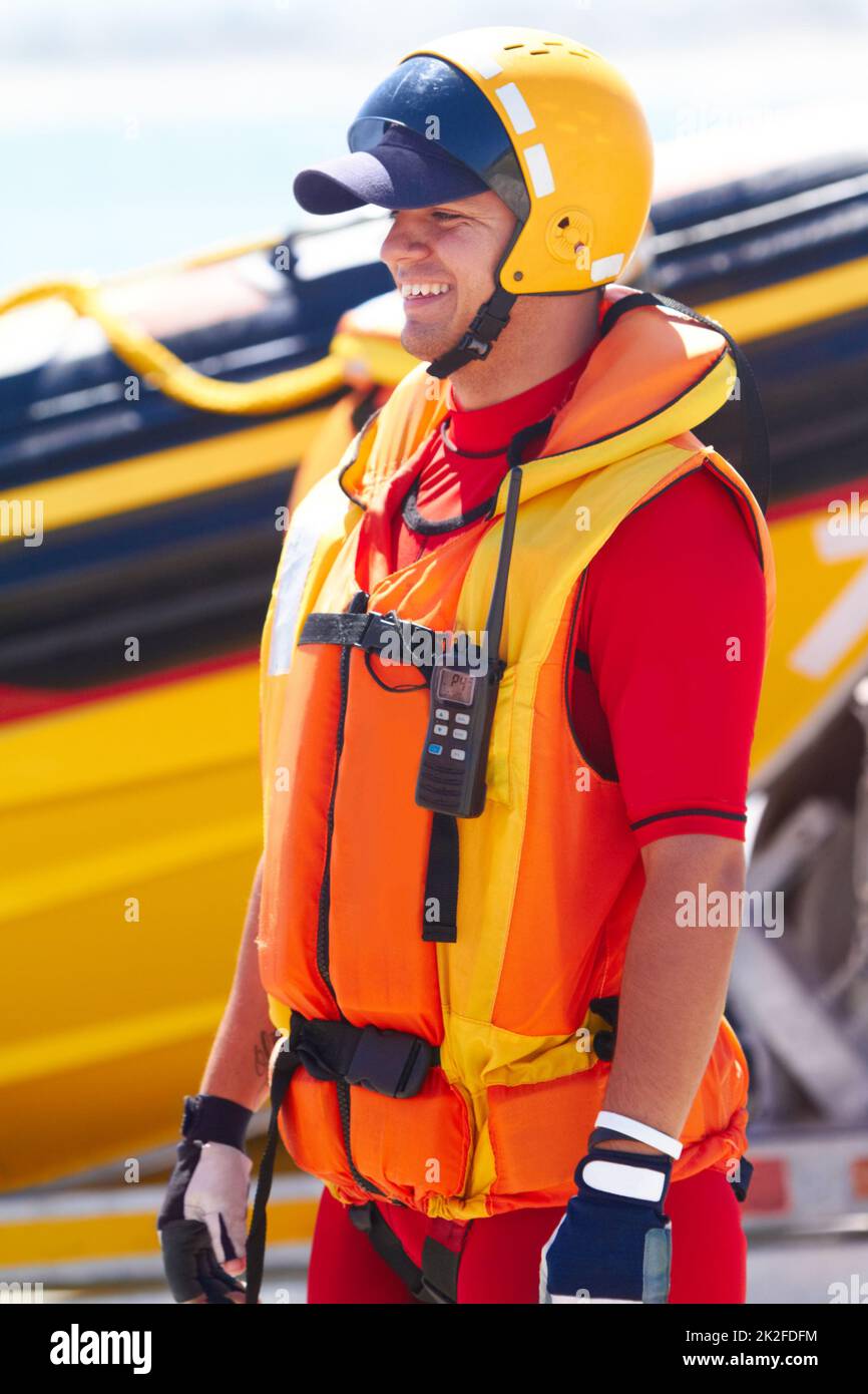 Salvataggio in mare. Un'operatrice di salvataggio in mare e il suo motoscafo. Foto Stock