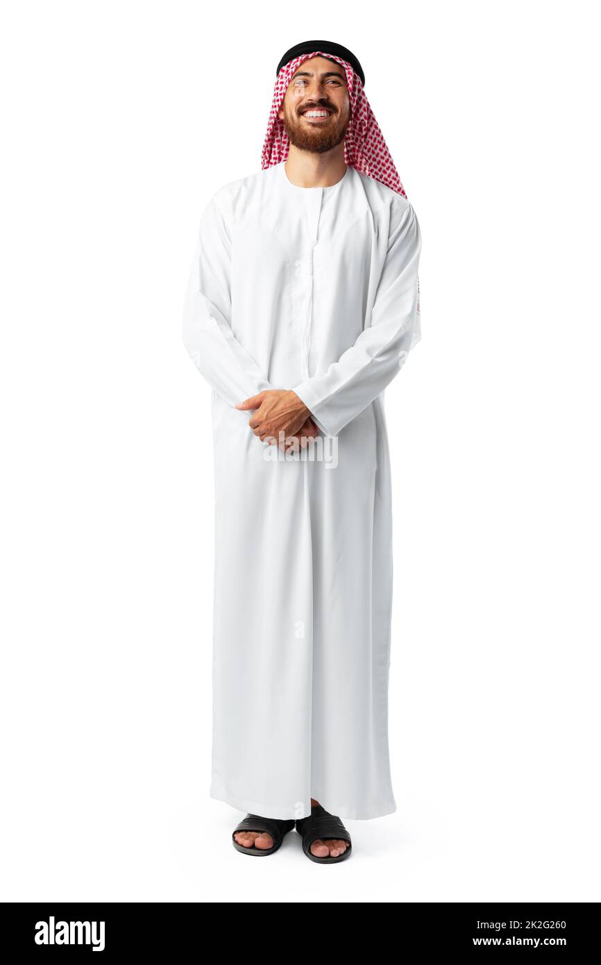 Sorridendo un uomo arabo mentre si è in piedi in uno studio bianco Foto Stock