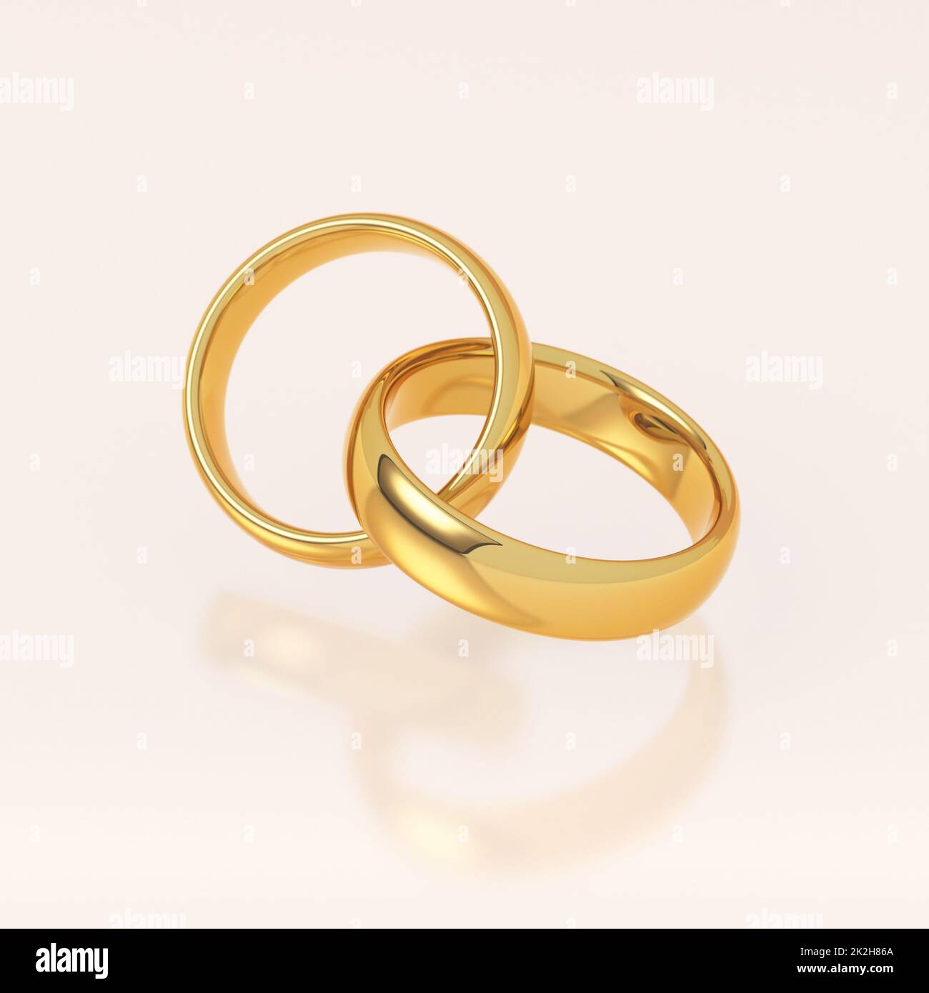 Due golden gli anelli di nozze Foto Stock