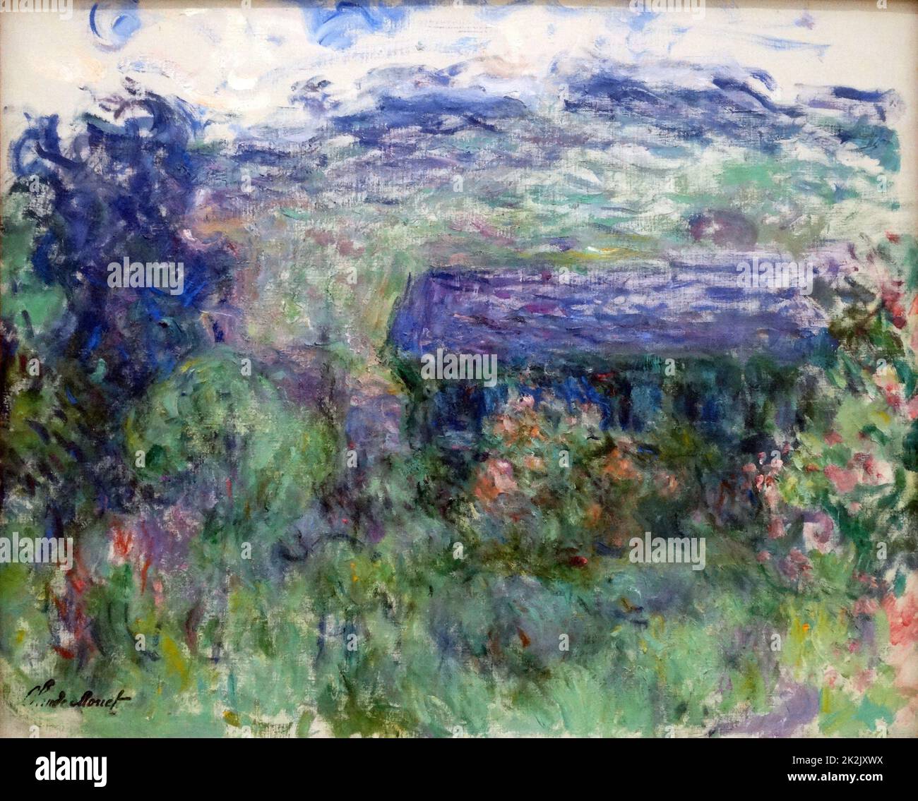 La Maison à Travers les Roses. 'The House Sveded Through the Roses' (olio su tela) di Claude Monet. 1925-1926 Museo Stedelijk di Arte moderna, Amsterdam Foto Stock