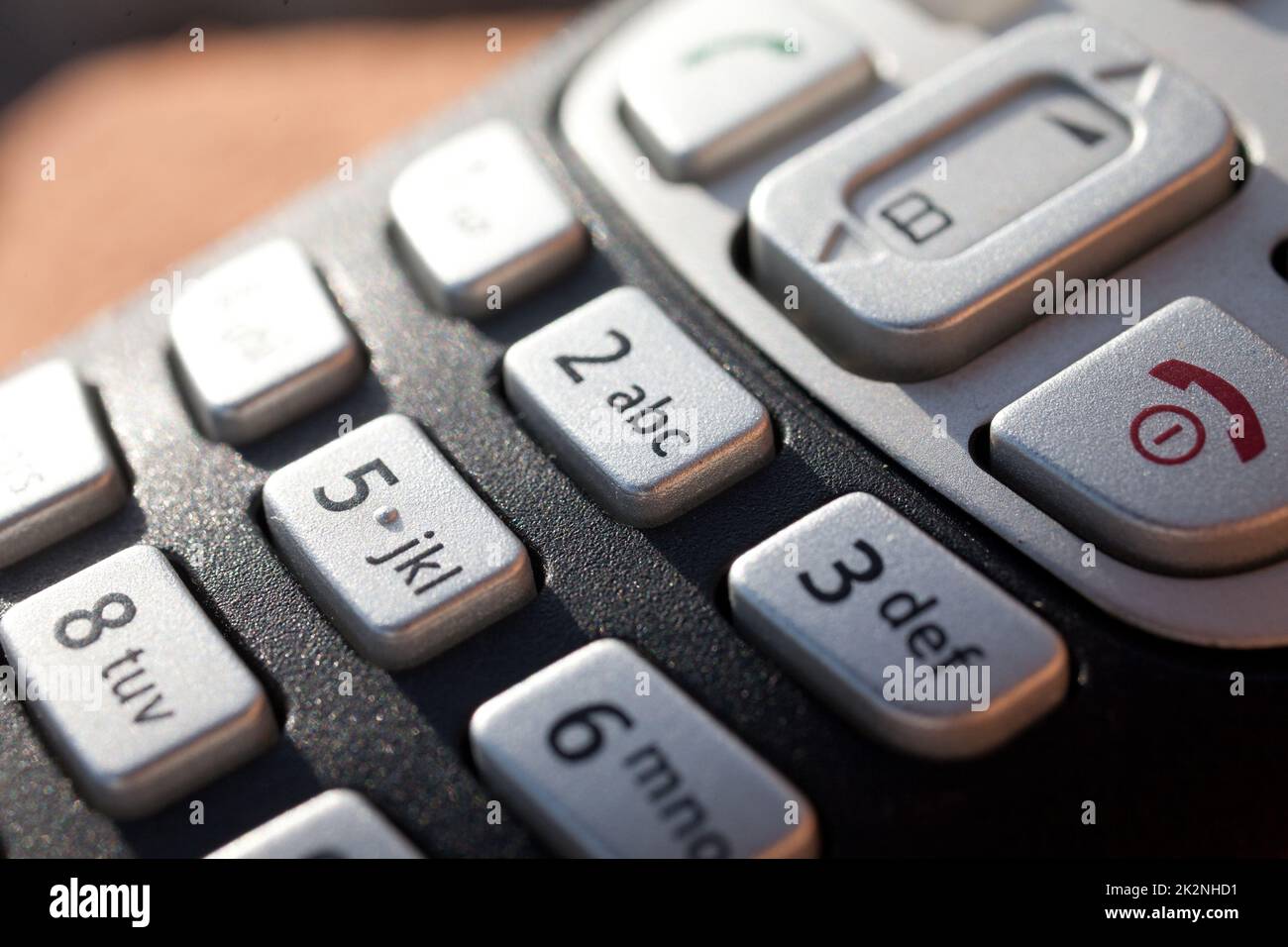 chiusura di una tastiera telefonica alla luce diretta del sole Foto Stock