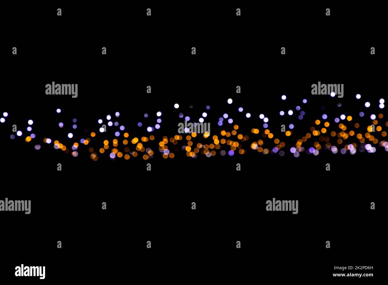 Sfondo nero con effetti di luce dorati Foto Stock
