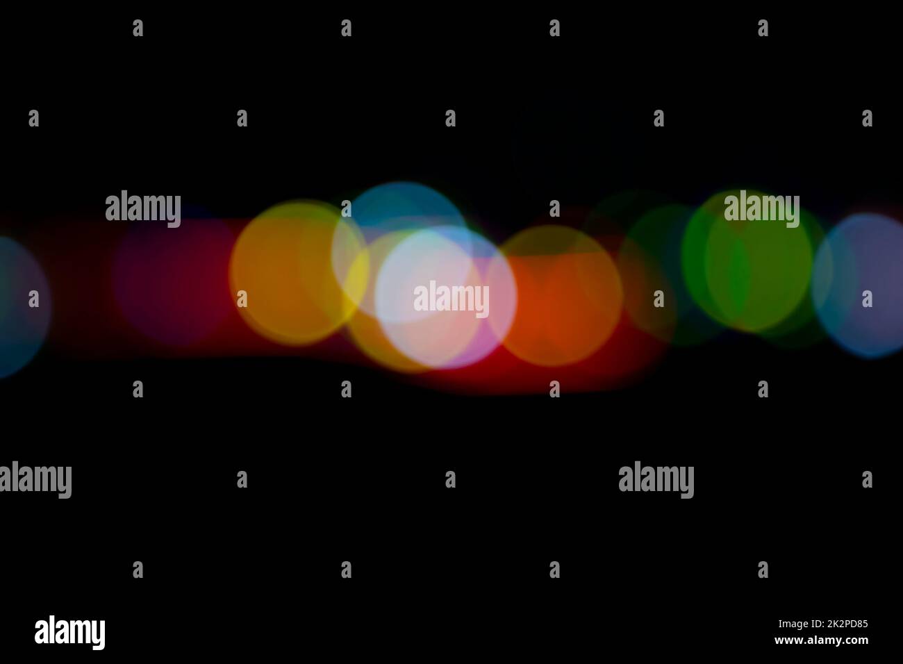 Sfondo nero con effetti di luce colorati Foto Stock