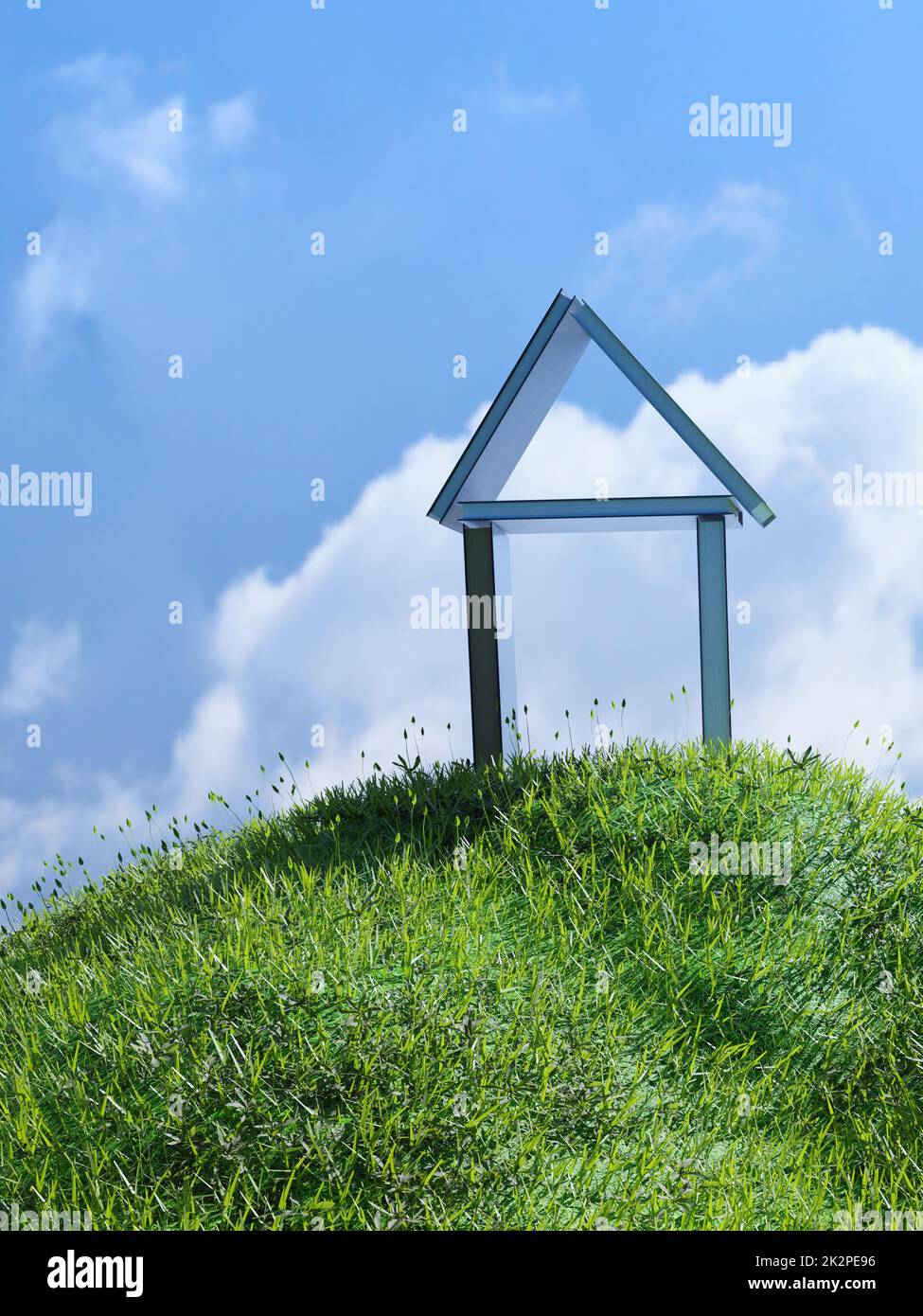 Casa fatta di libri su una piccola collina erbosa Foto Stock