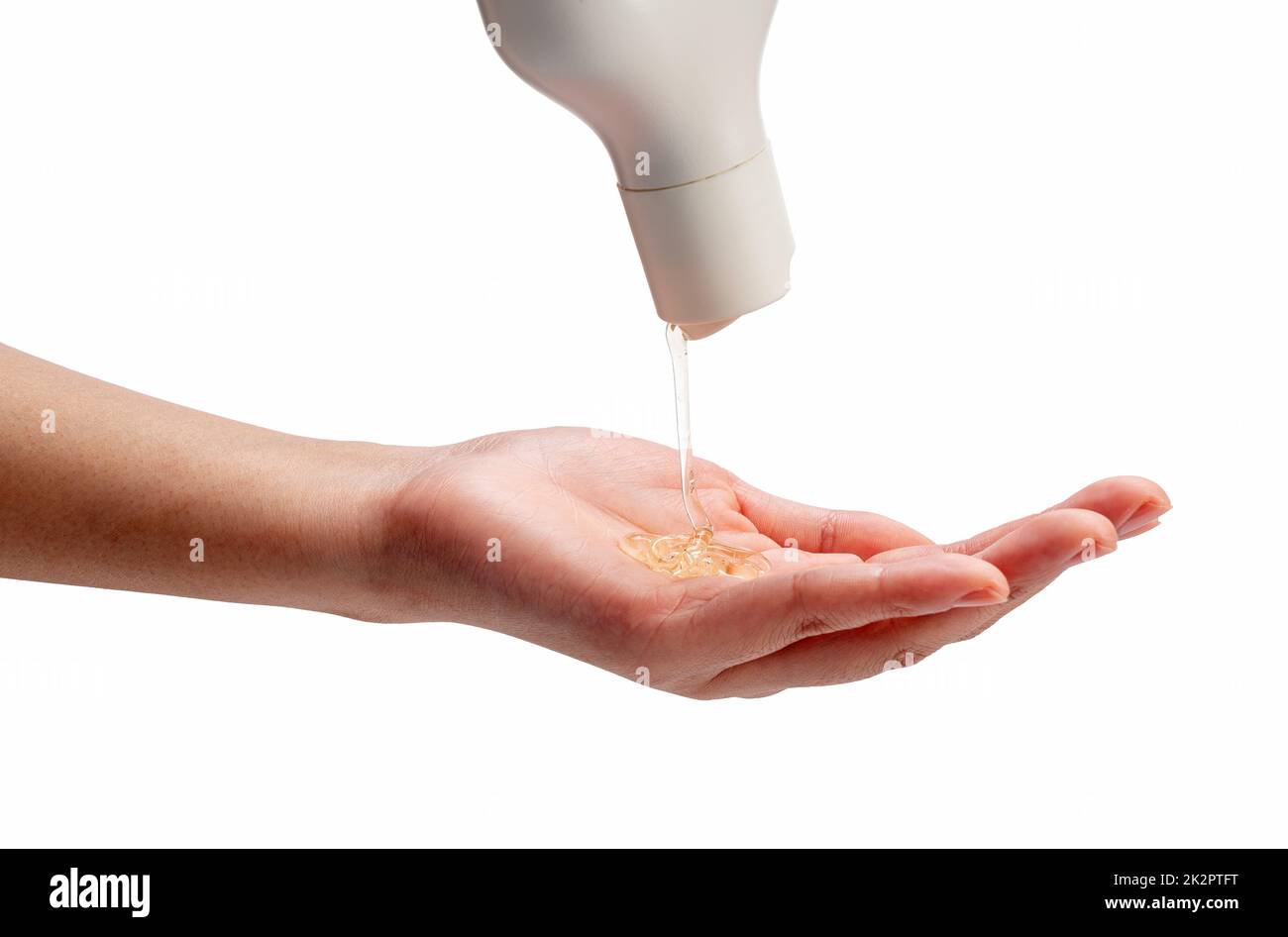 Sapone liquido versato sulle mani della donna su sfondo bianco. Foto Stock