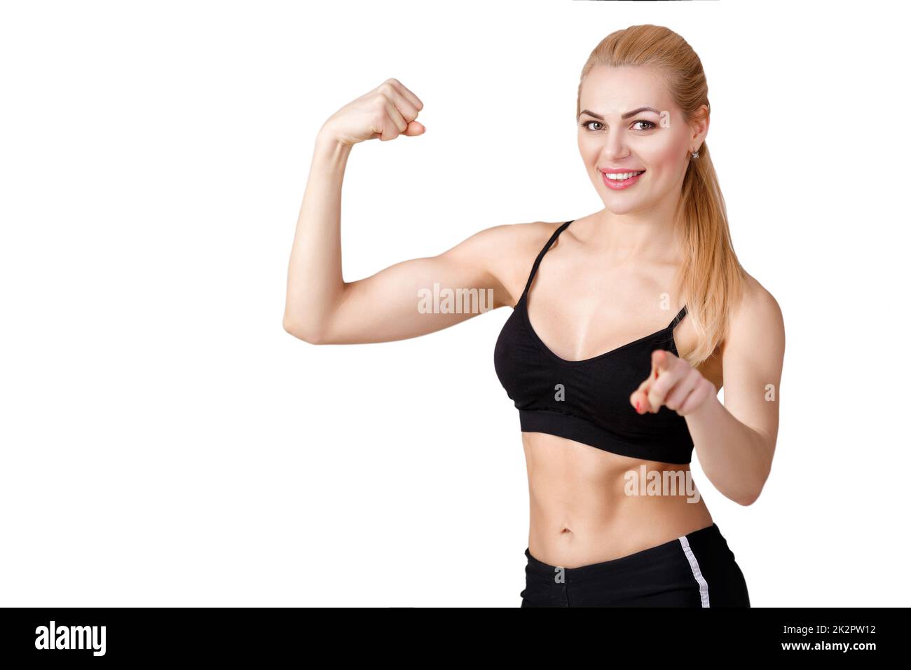 Ragazza in abbigliamento sportivo non esercita e guarda la fotocamera Foto Stock