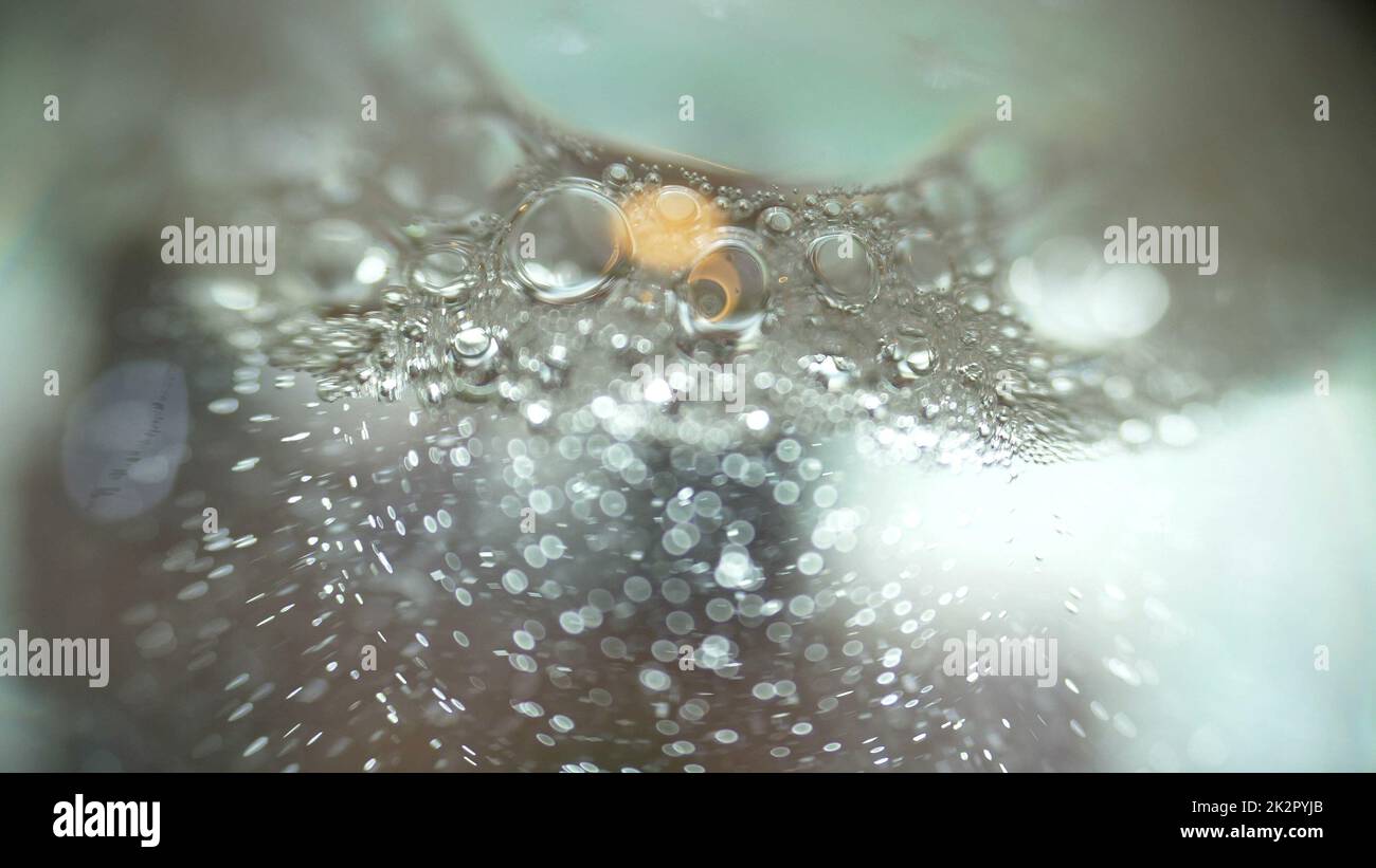 Le bolle in Una macro liquida hanno sparato profondità di campo poco profonda Foto Stock