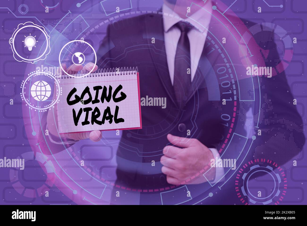 Segno che mostra andando virale. Parola scritta su immagine video o link che si diffonde rapidamente attraverso la popolazione uomo d'affari in tuta tenendo il blocco note che rappresenta il pensiero innovativo. Foto Stock
