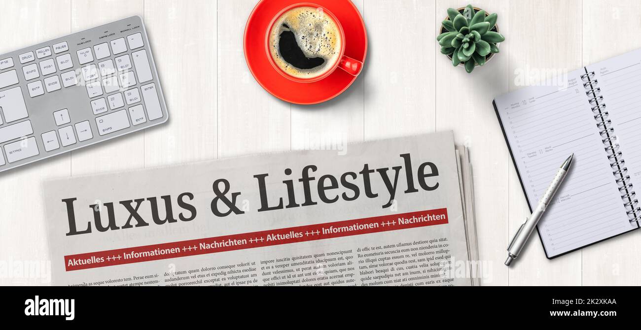 Quotidiano su una scrivania - Luxury and Lifestyle in tedesco - Luxus und Lifestyle Foto Stock