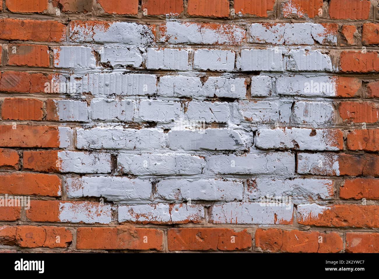 Vecchio sfondo o struttura della parete grunge danneggiata. Sfondo della strada Foto Stock