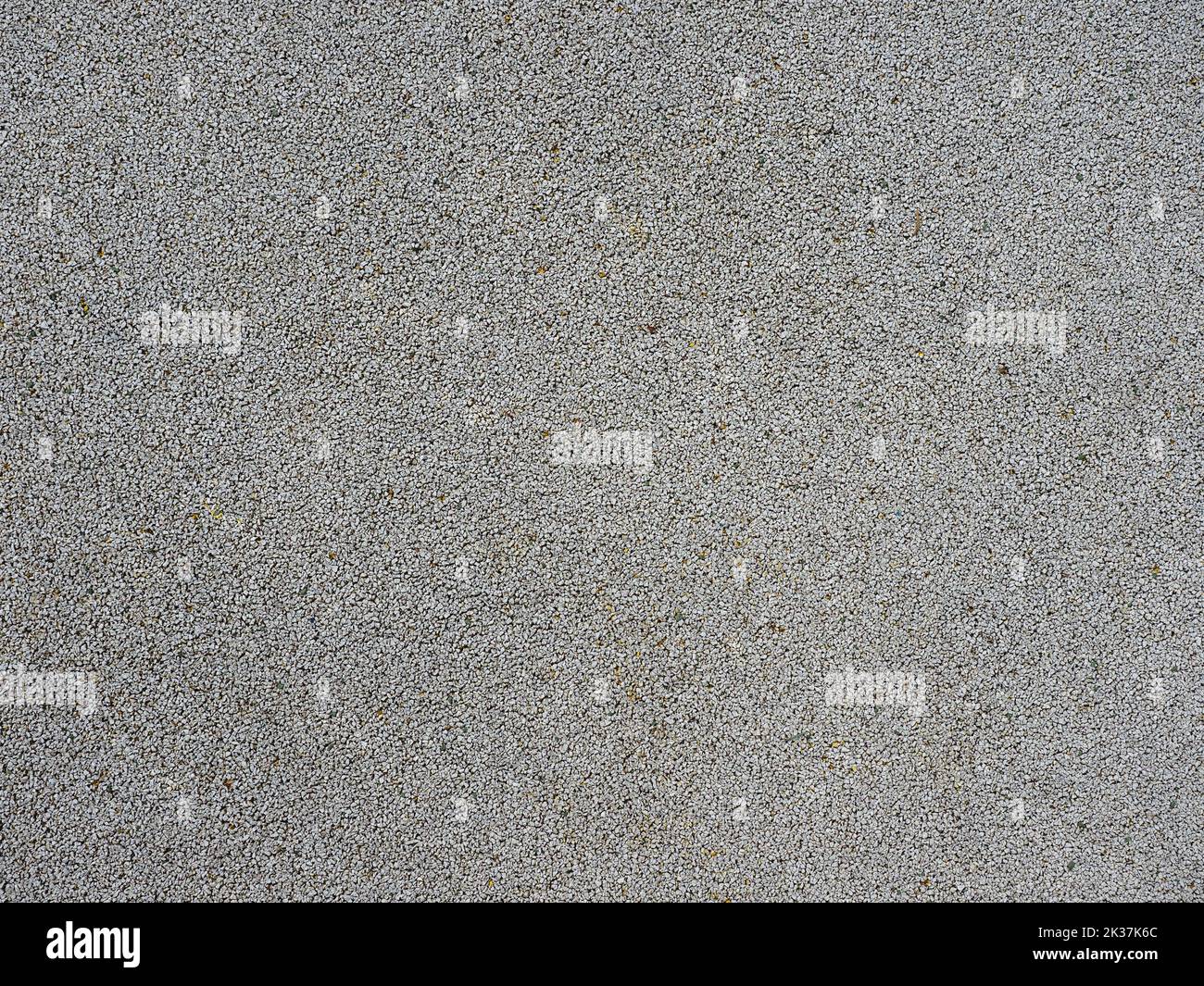 fondo texture ciottoli grigi. materiale pavimentazione parco o parco giochi Foto Stock