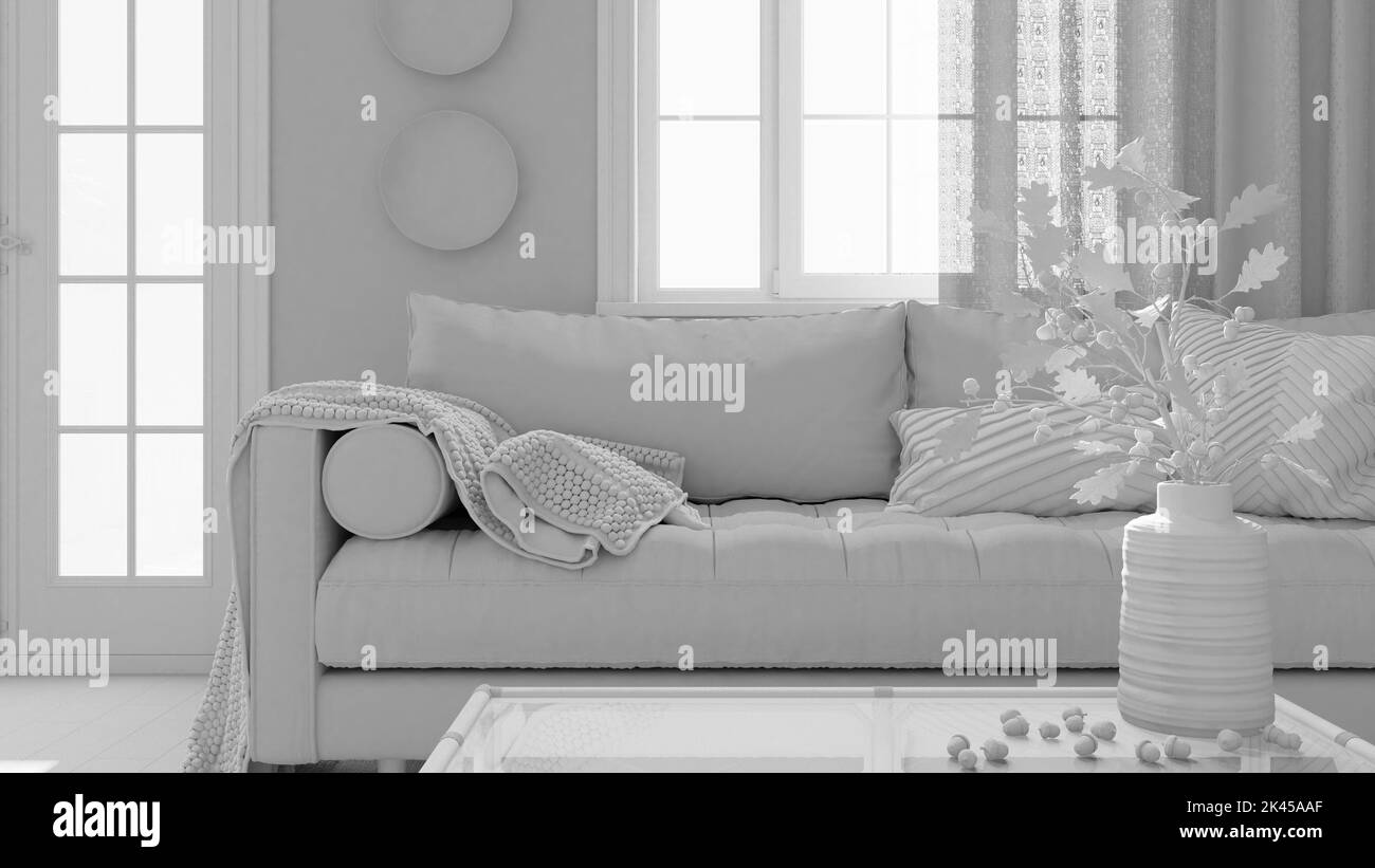 Progetto bianco totale, soggiorno vintage. Divano, tavolo in rattan con decori autunnali. Vaso con foglie asciutte e ghiande. Design boho chic, autunno interio Foto Stock