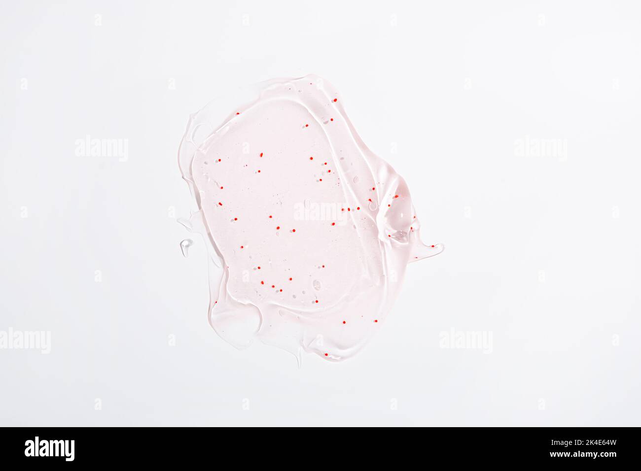 Skin care Concept Swatch gel idratante con particelle esfolianti vista dall'alto su superficie ligata Foto Stock