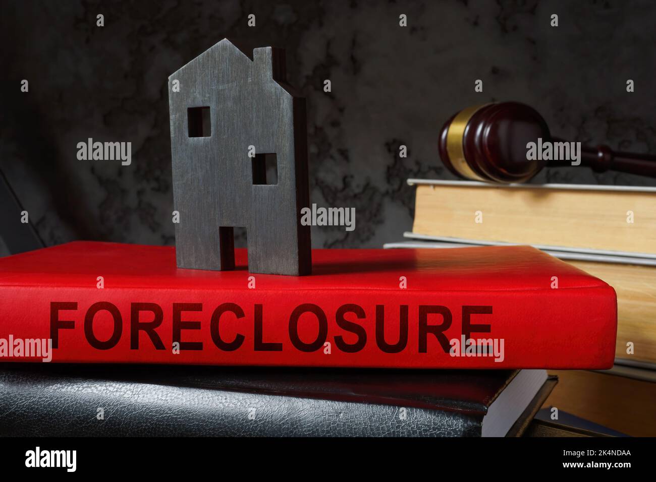 Prenota su preclusione e modello di casa su di esso. Foto Stock