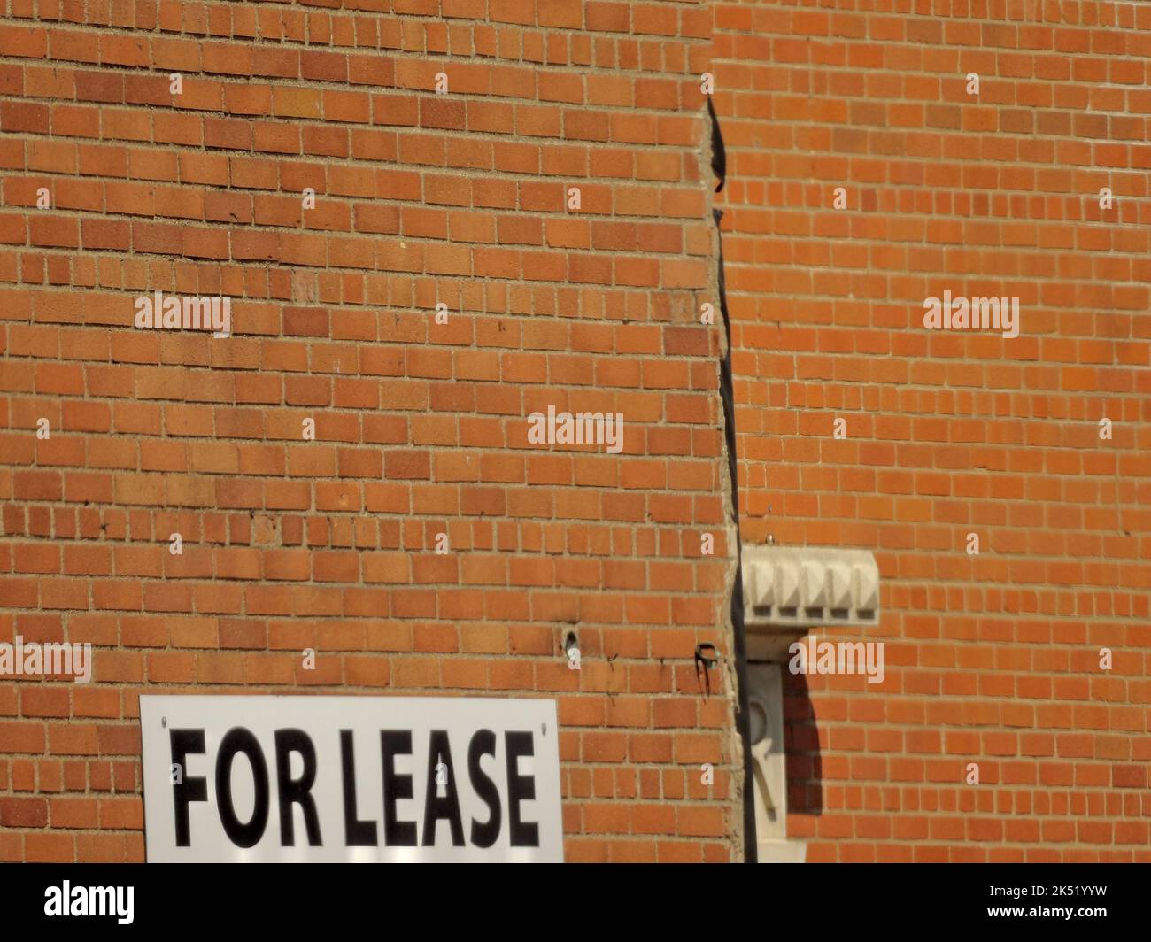 Il dettaglio di vecchio edificio in mattoni per il leasing Foto Stock