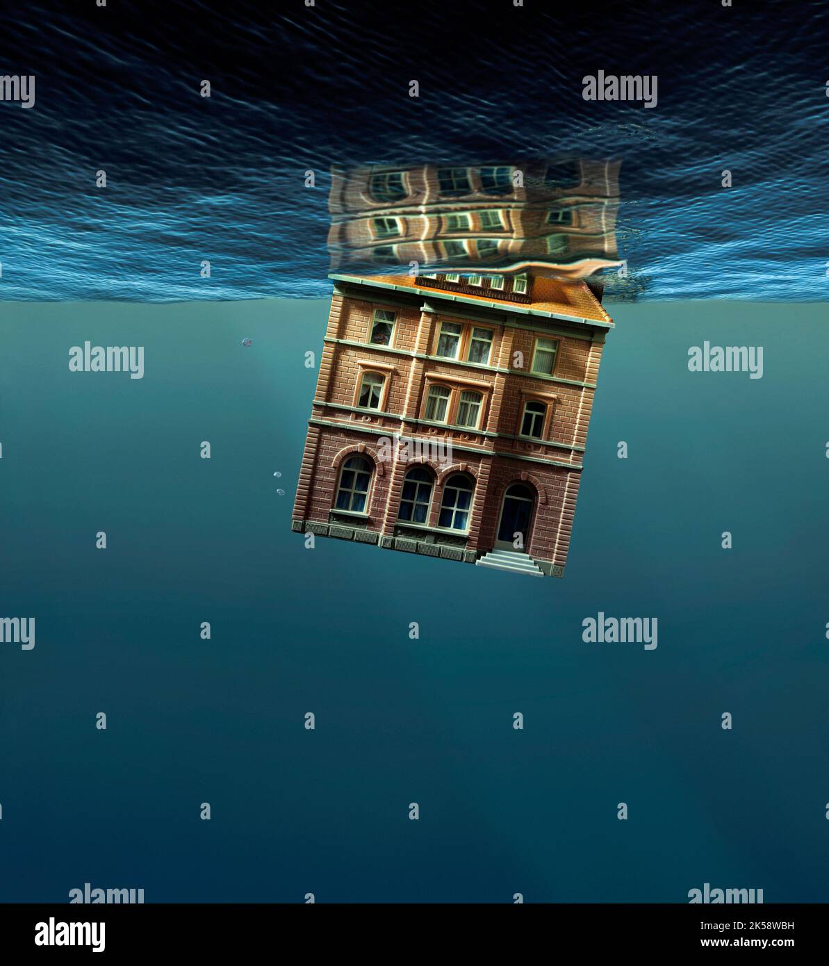 Casa modello affondando in acqua Foto Stock