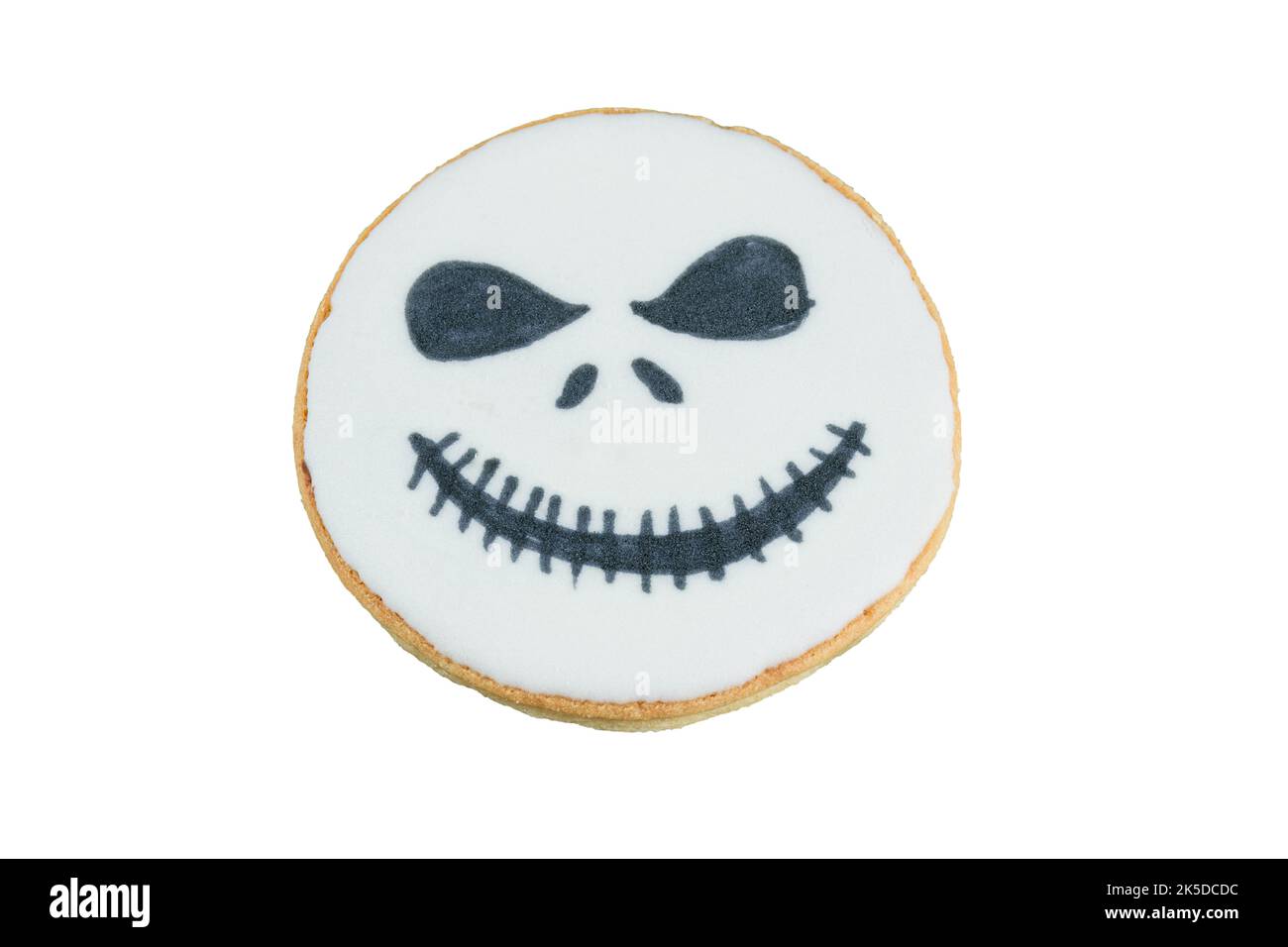 Biscotto burroso a forma di testa con un sorriso macabro. Foto Stock