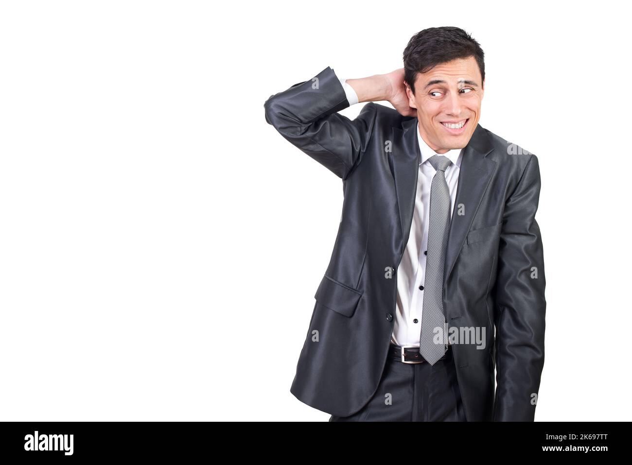 Uomo timido in abbigliamento formale che tocca la testa Foto Stock