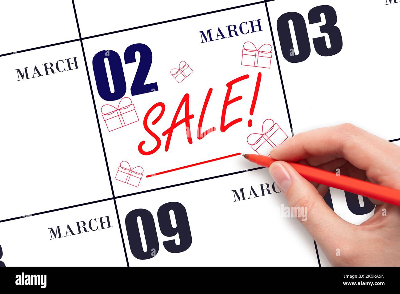 2nd° giorno di marzo. Vendita di testo a mano e disegni di scatole regalo in data di calendario 2 marzo. Promemoria per gli acquisti. Shopping online. Mese di primavera, giorno del Foto Stock