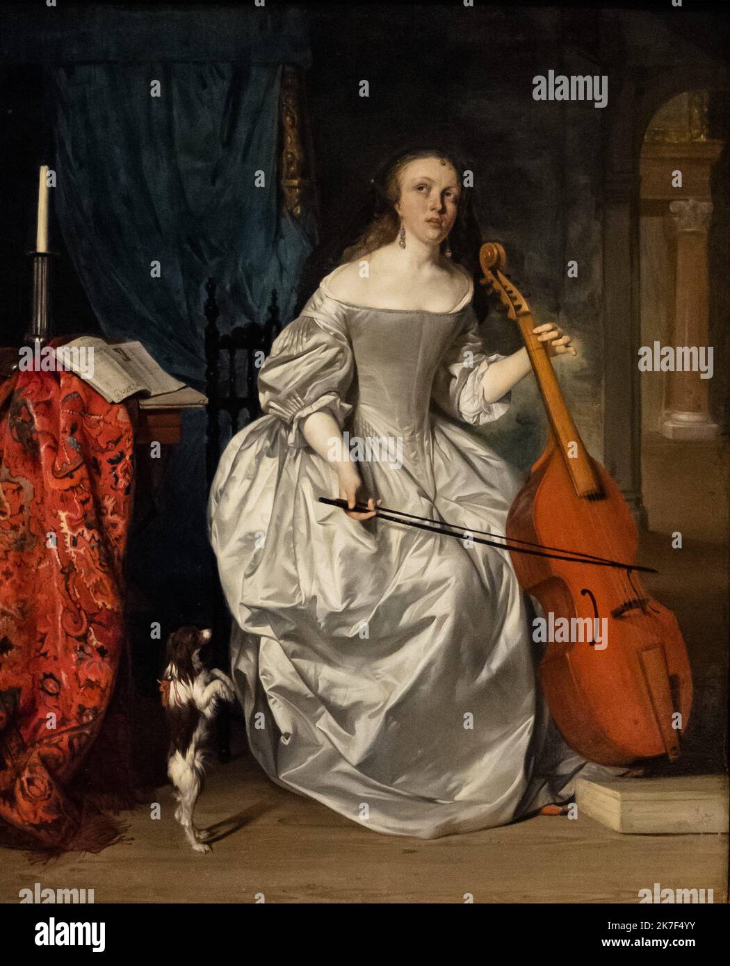 ©Active Museu/MAXPPP - ActiveMuseum 0000570.jpg / Femme jouant de la viole de gambe - Gabriel Metsu (1663) - 1663 - / Gabriel Metsu / Peinture Active Museum / le Pictorium Barocco ,Bow (Musica) ,candela () ,colonna ,cortina ,cane ,Abito ,orecchino ,strumento ,Musica ,Musica ,Musica ,Gioca (strumento) ,Tablotch verticale ,Viola da gamba ,Donna ,17th ° secolo ,Gabriel Metsu ,Pittura , Foto Stock