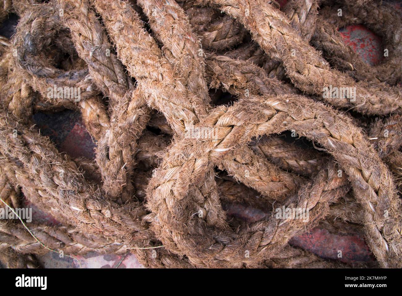 La corda sporca della iuta della pila può essere usata come texture di fondo Foto Stock