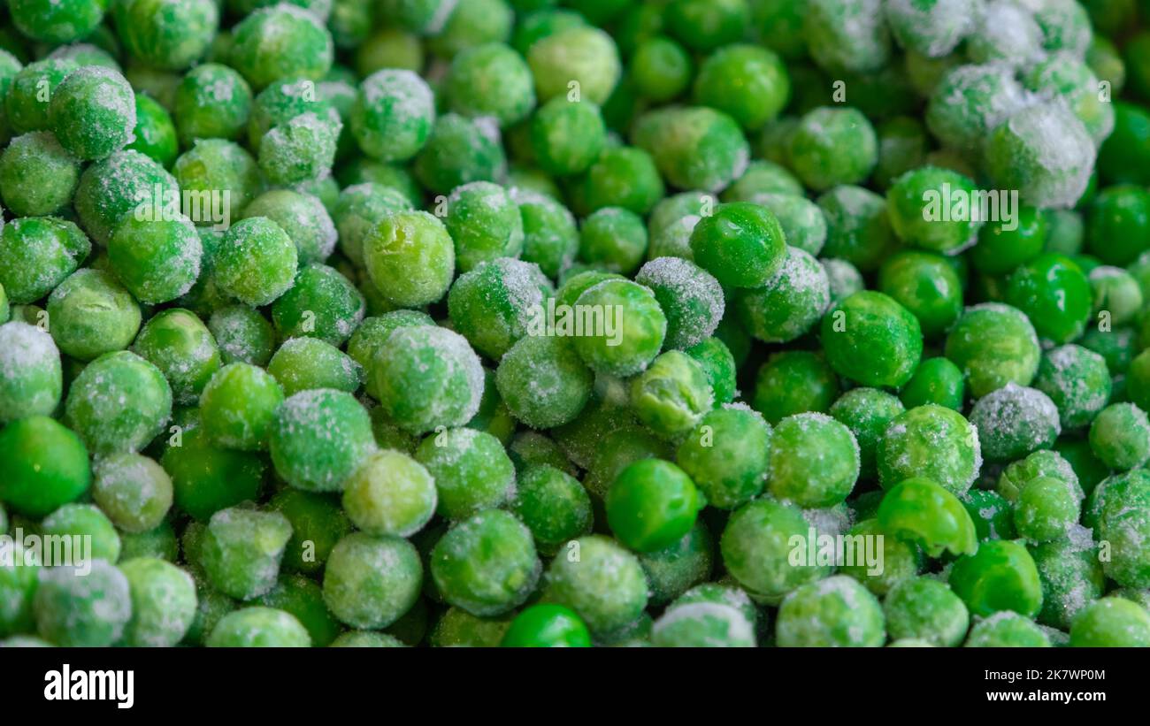Congelati pisello verde piselli texture Foto stock - Alamy